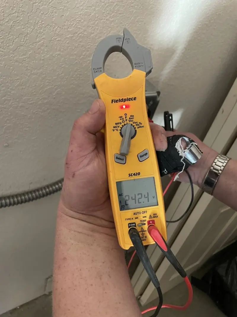 Voltage testing with clamp meter during Recessed Lighting Installation in Perth